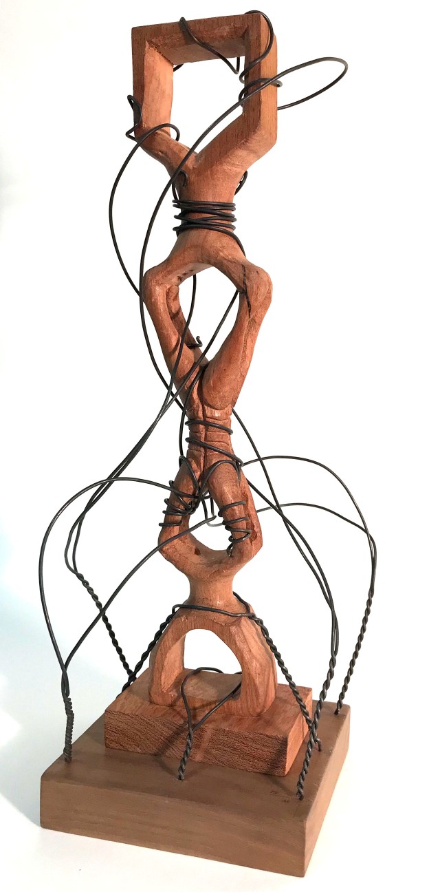 Art: wooden sculpture with wires stretching over it